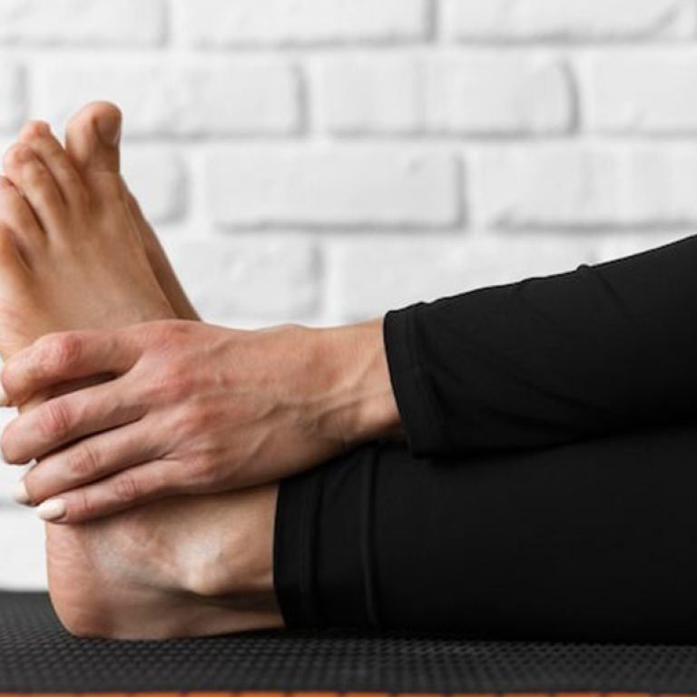 close-up-hands-holding-feet_23-2